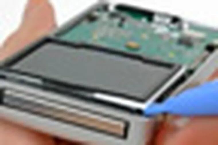 the teardown of the iflip video camera. in step 8 of the instructions, Use a plastic opening tool to carefully lift the top edge of the display out of its bracket. It may be necessary to use a metal spudger to release a small piece of film stuck between the LCD and the display bracket.