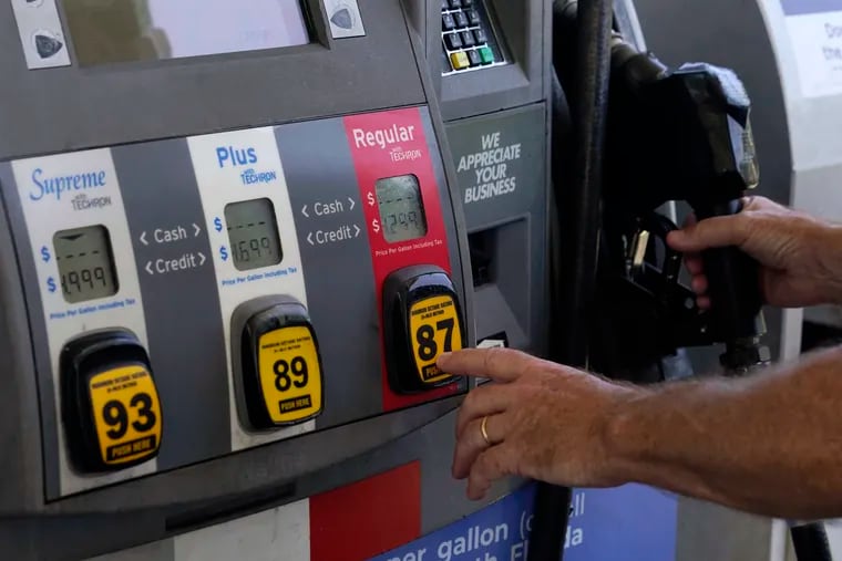 A customer pumps gas at an Exxon gas station in Miami.