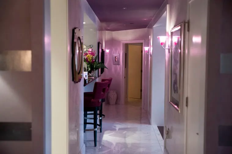 Splashes of pink and silver and shimmery light from custom fixtures set the tone for the condo's Art Deco interior.