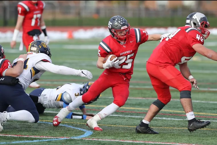 Upper Dublin's Lucas Roselli (25) gains yardage in Saturday's PIAA District 1 Class 5A semifinal playoff romp over Unionville.