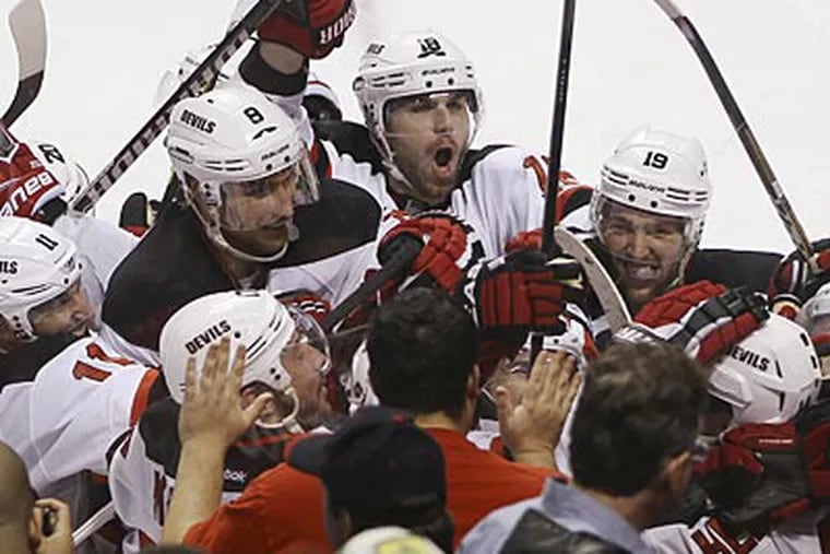 The Devils defeated the Panthers, 3-2, in double overtime in Game 7 to advance. (J Pat Carter/AP)