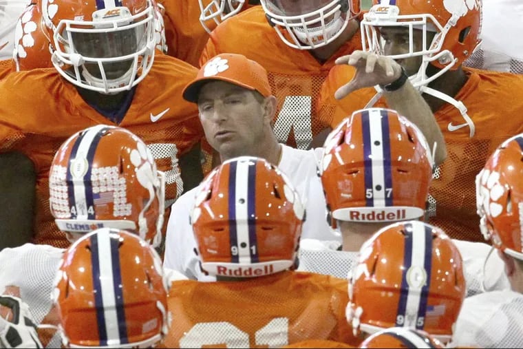 Dabo Swinney (center) has his Clemson Tigers off to a strong start.
