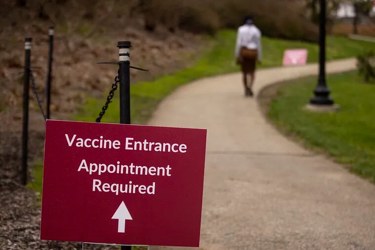 Signs lead to a Haverford College vaccine clinic on Wednesday, April 13, 2021.