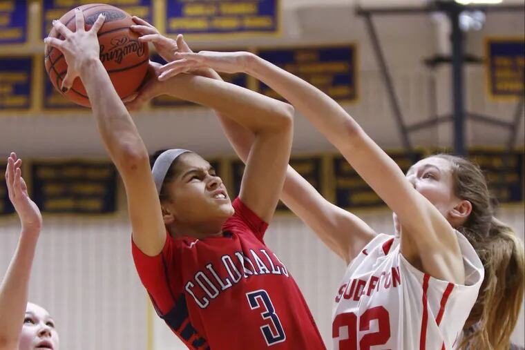 Plymouth Whitemarsh’s Taylor O’Brien, left, shoots over Souderton’s Kate Connolly.