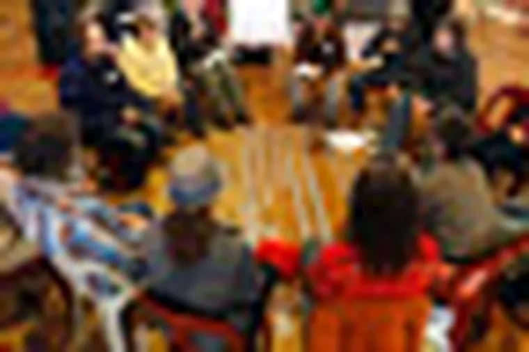 Occupy activists attend a nonviolent civil disobedience training at the Occupy the Caucus headquarters, Tuesday, Dec. 27, 2011, in Des Moines, Iowa. Starting Wednesday, Occupy protesters are vowing to interrupt candidates at events and make life difficult at their Iowa offices by camping inside or outside them. They say they want to change the political dialogue, but critics fear their tactics could tarnish Iowa's reputation for civil political discourse ahead of the Jan. 3 caucuses. (AP Photo/Charlie Neibergall)