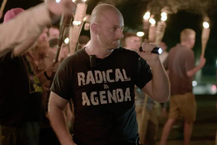FILE – In this Friday, Aug. 11, 2017, file image made from a video provided by Vice News Tonight, Christopher Cantwell attends a white nationalist rally in Charlottesville, Va.
