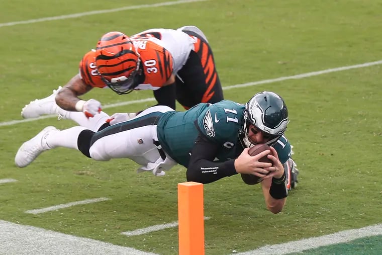 Eagles quarterback Carson Wentz did a much better job of running with the football Sunday than he did throwing it.