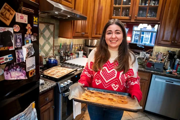 Alice LaBan, 22, posed for a portrait with gluten-free cookies at her home in Philadelphia, Pa. on Wednesday, November 17, 2021. Alice was diagnosed with Celiac disease earlier this year.