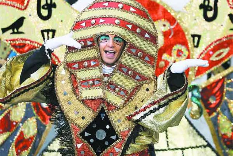 A member of Hog Island Fancy Brigade dances to "Walk like an Egyptian" during their performance. Coverage of the 113th Annual Mummer's parade. PPARADE02 01/01/2013 ( MICHAEL BRYANT / Staff Photographer )