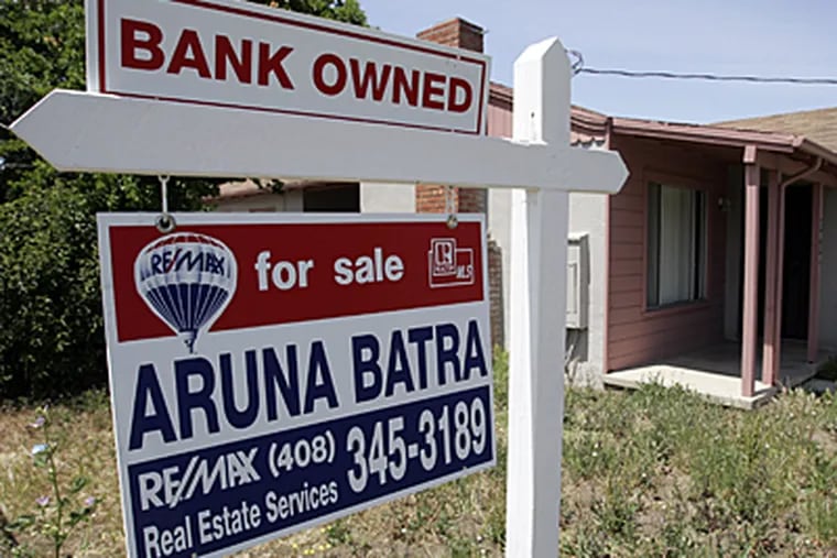 A foreclosure sign posted at a Calif. home. Home sales locally and nationally are off.. (AP)