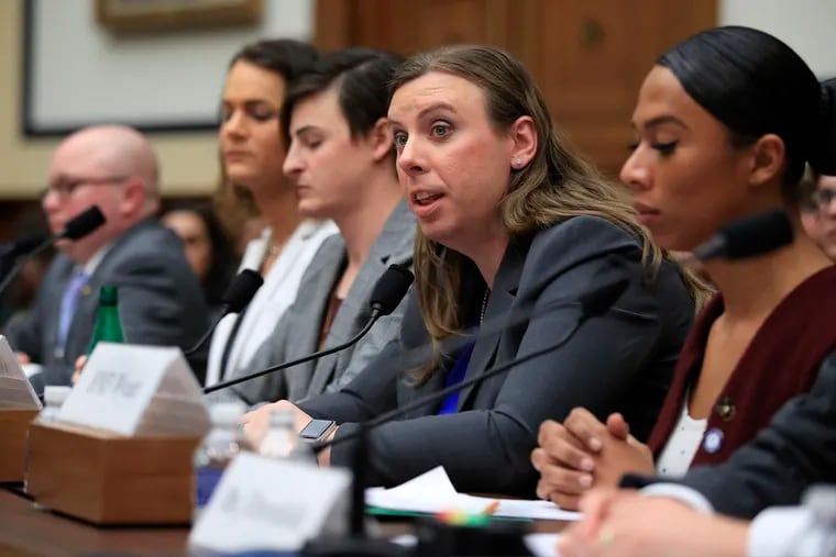 FILE- In this Feb. 27, 2019 file photo, Army Staff Sgt. Patricia King, second from right, together with other transgender military members, from left, Navy Lt. Cmdr. Blake Dremann, Army Capt. Alivia Stehlik, Army Capt. Jennifer Peace and Navy Petty Officer Third Class Akira Wyatt, testify about their military service before a House Armed Services Subcommittee on Military Personnel hearing on Capitol Hill in Washington. A new Trump administration regulation set to go into effect Friday, April 12,  directs military secretaries to kick out transgender service members who refuse to serve in their birth sex and "given an opportunity to correct those deficiencies." (AP Photo/Manuel Balce Ceneta, File)