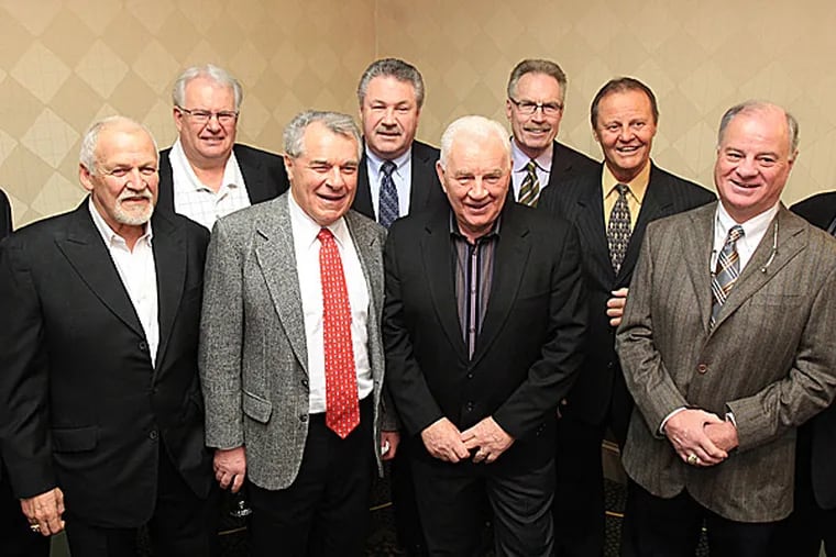 Members of the 1974 Stanley Cup winning Flyers. (Charles Fox/Staff Photographer)