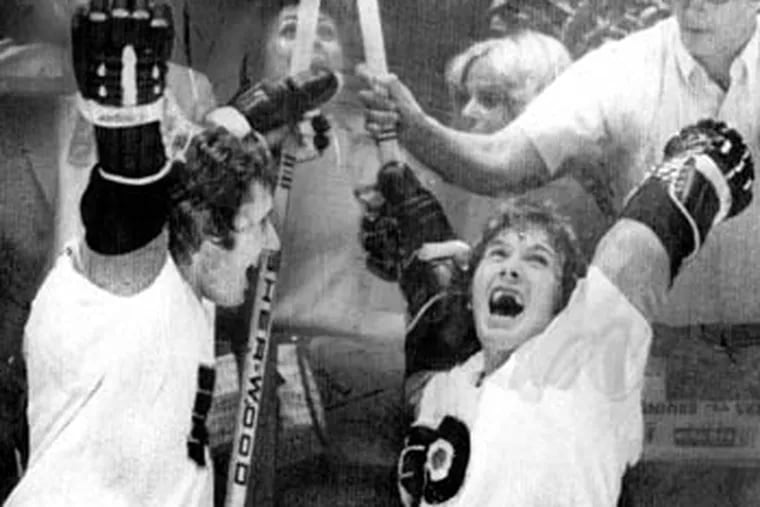 Bobby Clarke (right) and Don Saleski (left) celebrate the Flyers' Stanley Cup victory over the Boston Bruins on May 20 1974.
