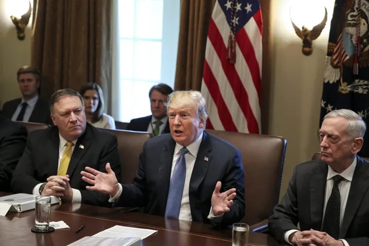 President Trump, flanked by Secretary of State Mike Pompeo (left) and Secretary of Defense James Mattis, speaks during a Cabinet meeting in the Cabinet Room of the White House on June 21, 2018.