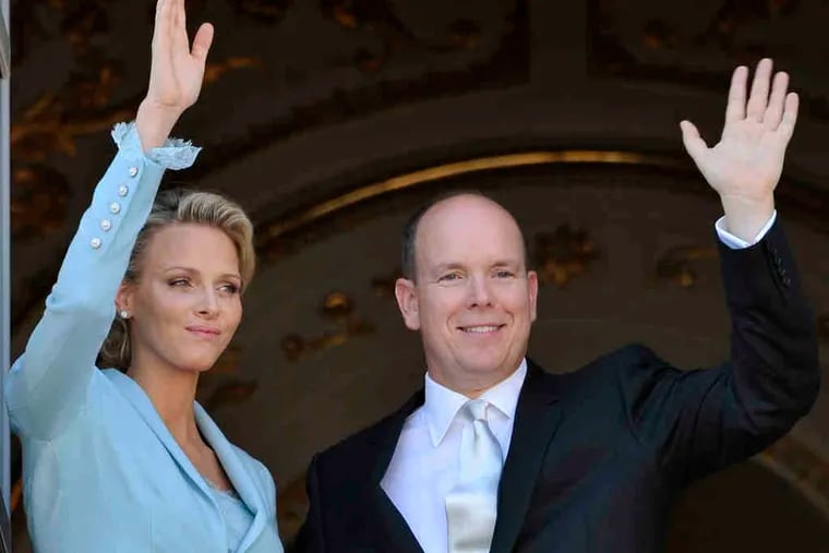 Princess Charlene and Prince Albert II of Monaco pictured after their civil marriage ceremony in 2011. The Rev. William McCandless, a former adviser to the princess, was indicted Wednesday in Philadelphia on child pornography charges.