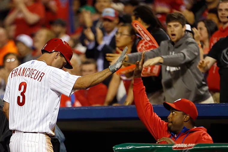 The Phillies' Jeff Francoeur high-fives teammate Jerome Williams after
Francoeur hit a seventh-inning RBI single against the Arizona Diamondbacks on Friday, May 15, 2015 in Philadelphia.  ( YONG KIM /Staff Photographer )
