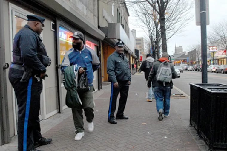 Camden officers on patrol on Broadway near Stevens Street. (April Saul / Staff Photographer)