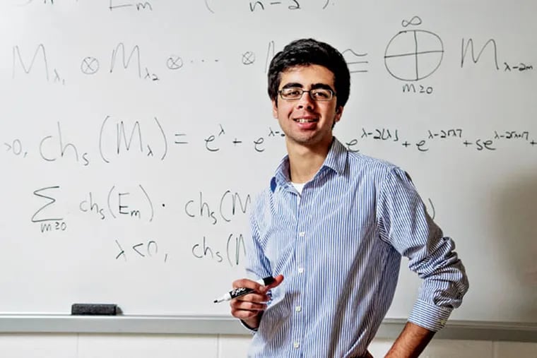 Unionville High School senior Shashwat Kishore, 18, shows some of the math that is gaining him national attention. ( CLEM MURRAY / Staff Photographer )