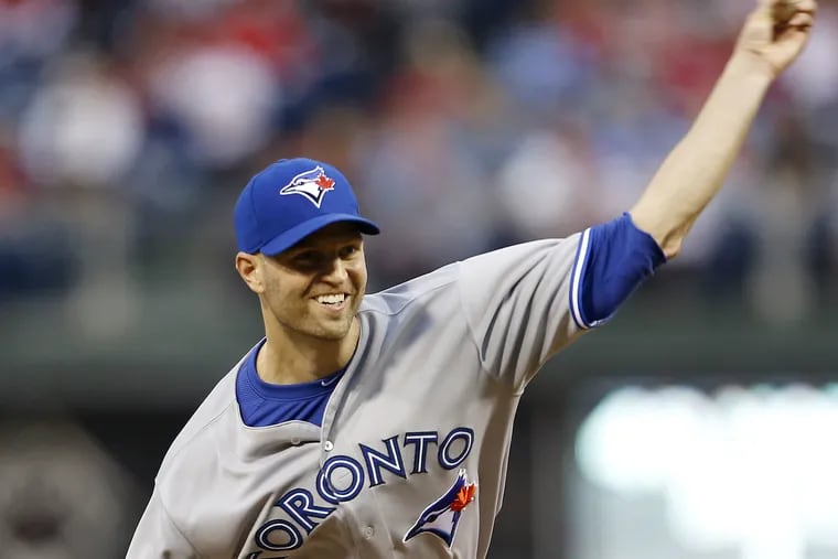 Blue Jays' J.A. Happ delivers a pitch in his strong outing against his former team.