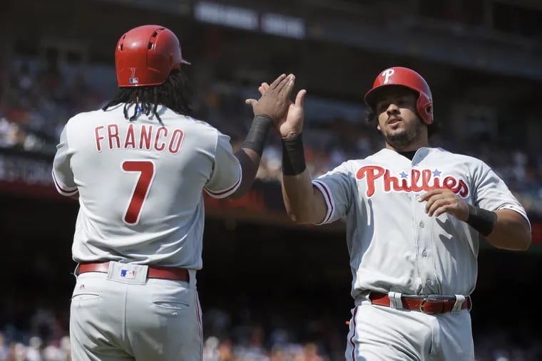 Jorge Alfaro, right, celebrates with Maikel Franco after scoring in the Phillies’ 5-2 win over San Francisco.