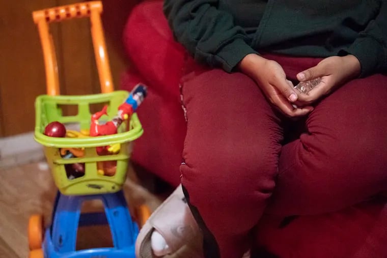 Noema Allavez Perez ,mother of missing 5-year old Dulce Maria Alavez, holds a crystal cross in her hands during an interview at her home in Bridgeton, N.J. Wednesday, September 18, 2019.