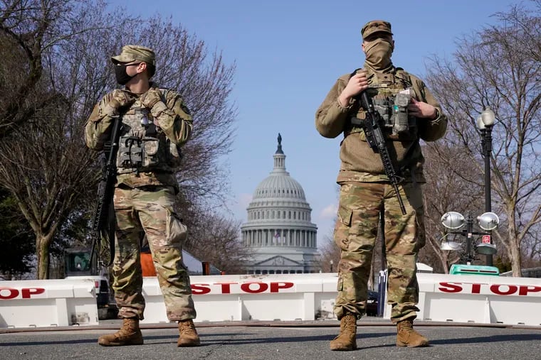 National Guard keep watch over the U.S. Capitol on Thursday.