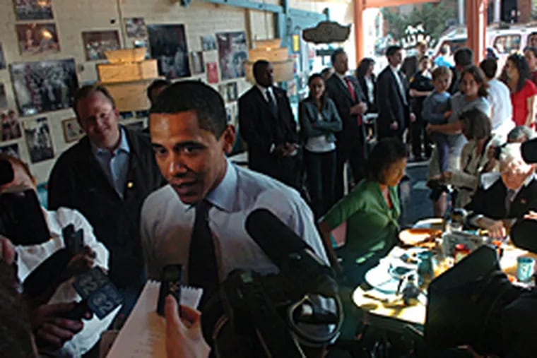 Sen. Barack Obama talks with the media at Pamela's P&G Diner in Pittsburgh Tuesday morning. (Sarah J. Glover / Inquirer)