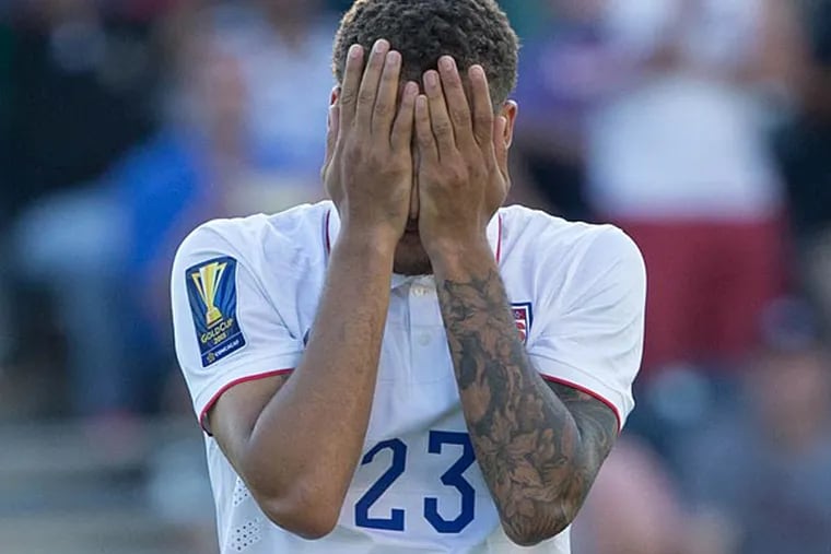 United States defender Fabian Johnson (23) reacts after missing his penalty kick in overtime against Panama in the CONCACAF Gold Cup third place match at PPL Park. Mandatory Credit: Panama wins on penalty kicks after a 1-1 draw. (Bill Streicher/USA Today)