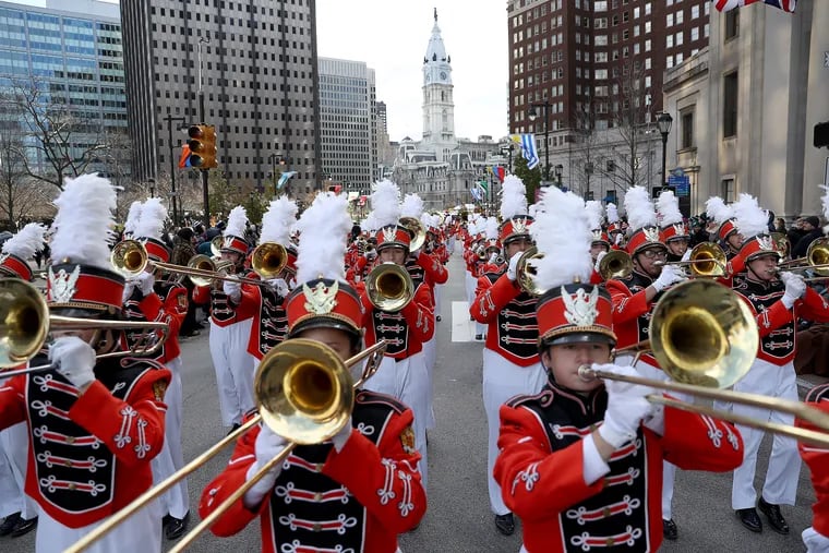 Members of the Pennsbury High School marching band perform on the Ben Franklin Parkway during the 6ABC Dunkin’ Thanksgiving Day Parade in 2019.