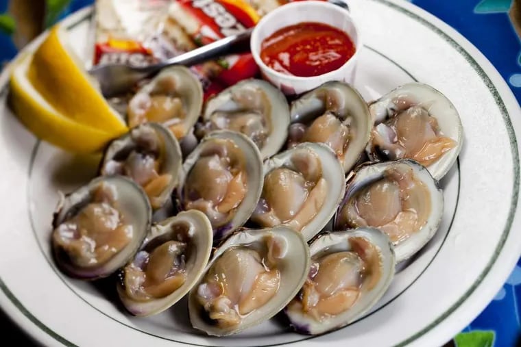 A dozen cold littleneck clams on the half shell served at the Clam Bar, the straight-ahead, no-frills seafood shack in Somers Point, known as Smitty's.