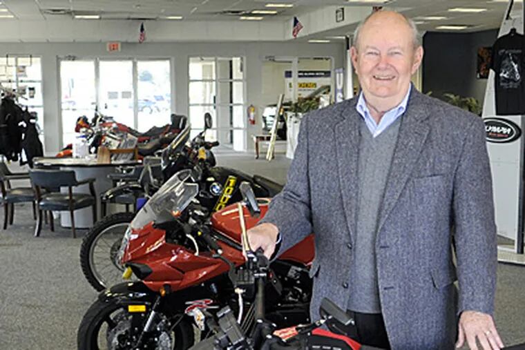 Ted Eckenhoff poses with a Zero S electric motorcycle at his Eckenhoff Motorcycles in Cherry Hill on April 3. (Tom Gralish / Staff Photographer)
