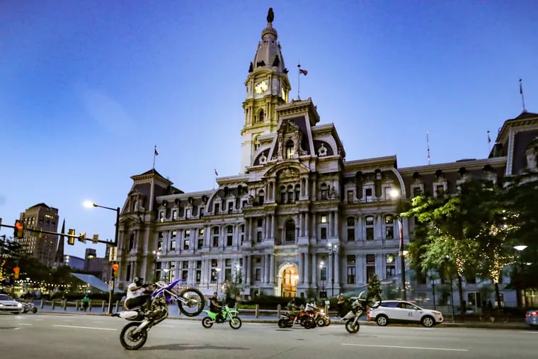 ATVs and dirt bikes and other motorcycles ride past City Hall just before 9 p.m. on Tuesday, June 15.