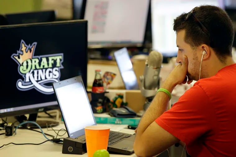 A worker at DraftKings' Boston offices. After a ruling was reversed Friday, the two big fantasy sports companies can continue to do business in New York state.