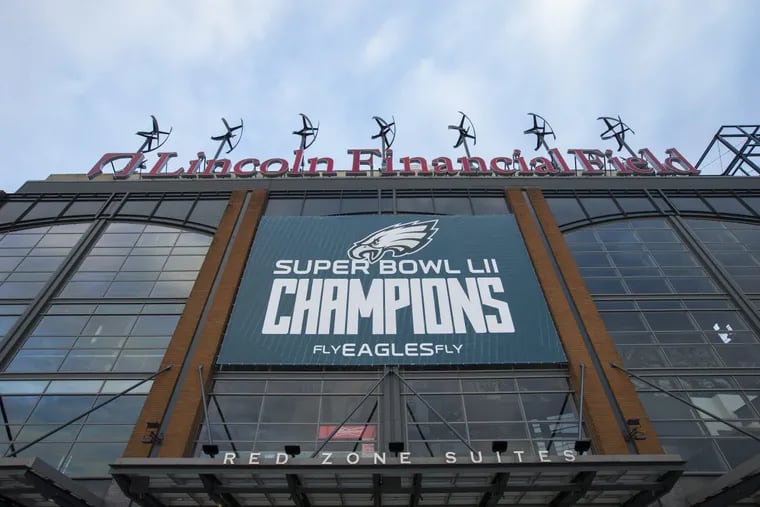 The Philadelphia Eagles hung championship banners on the outside of Lincoln Financial Field on March 6, 2018. CHARLES FOX / Staff Photographer
