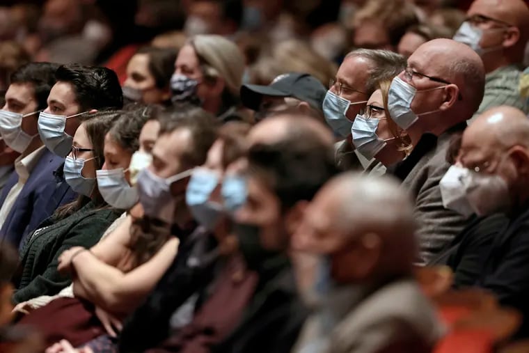 Guests watch and listen to the Philadelphia Orchestra perform the Messiah at the Kimmel Center’s Verizon Hall in Philadelphia on Wednesday. Because of COVID-19, all guests at the Kimmel Center must show proof of COVID-19 vaccination and must wear a mask.