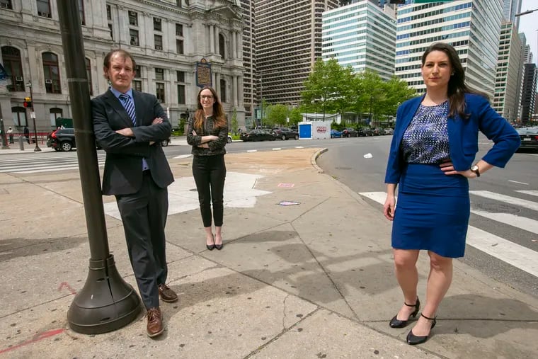 Supervisor Jonah Eaton and two staff attorneys, Maggie Kopel (in black) and Lilah Thompson, are pictured outside the north side of Philadelphia City Hall. The City of Philadelphia initially cut funding for the Pennsylvania Immigrant Family Unity Project, but that money has now been restored.