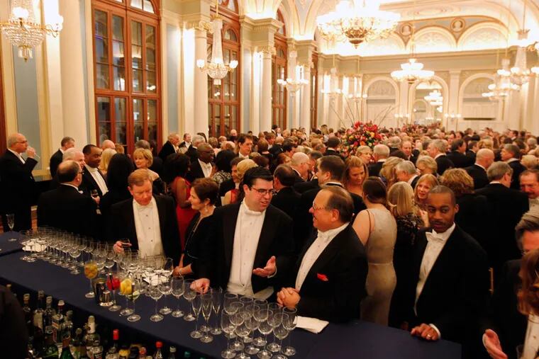 Overall shot of the preconcert cocktail party on the second floor of the Academy of Music for the 2014 Academy Ball. Such glittering social scenes didn't happen in 2016 because the ball was canceled due to snow on Jan. 23, 2016.