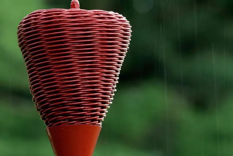 Raindrops fall on a wicker basket as weather delays the first round of the U.S. Open golf tournament at Merion Golf Club, Thursday, June 13, 2013, in Ardmore, Pa. (Julio Cortez/AP)