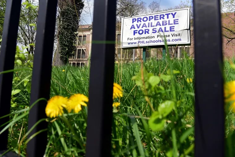 A For Sale sign at the Germantown Avenue entrance April 18, 2019, after Germantown High School closed in 2013. In 2017, a developer bought the property for about 6 percent of its assessed value, but now thousands of unpaid property taxes later, it's up for sale again.