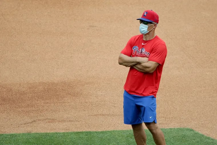 Manager Joe Girardi watches as the Phillies work out at Citizens Bank Park on Monday.