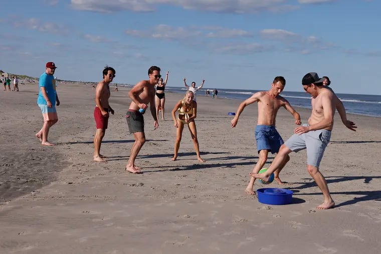 Locals from Cape May Courthouse play soccer on the beach in Stone Harbor on Memorial Day.