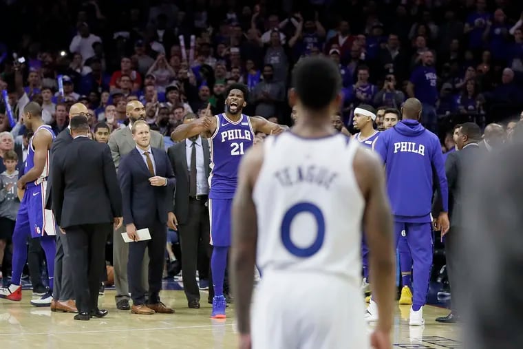 Sixers Joel Embiid reacts after learning he is ejected from the game after a third quarter altercation with the Timberwolves' Karl-Anthony Towns.