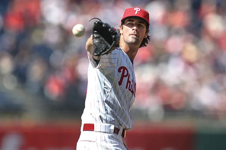 Phillies pitcher Cole Hamels gets the ball back while pitching against the Red Sox. (Steven M. Falk/Staff Photographer)