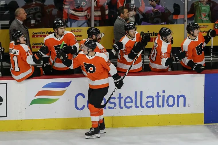 The Flyers' Justin Braun celebrates his empty-net goal against the Penguins.