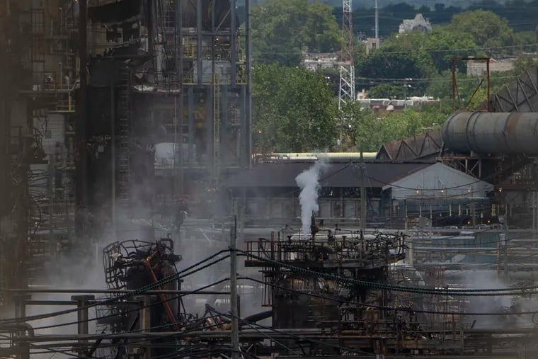 A view of the damaged refinery at the Philadelphia Energy Solutions (PES) following Friday's explosion can be seen from the George C. Platt Memorial Bridge on Saturday, June 22, 2019.