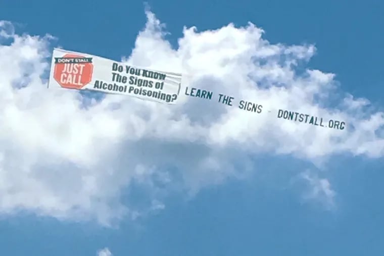 Mary Ciammetti's organization, Don't Stall, Just Call, has been flying this banner along the Jersey shore on Sundays this summer. She hopes the life-saving mesasge will help others.