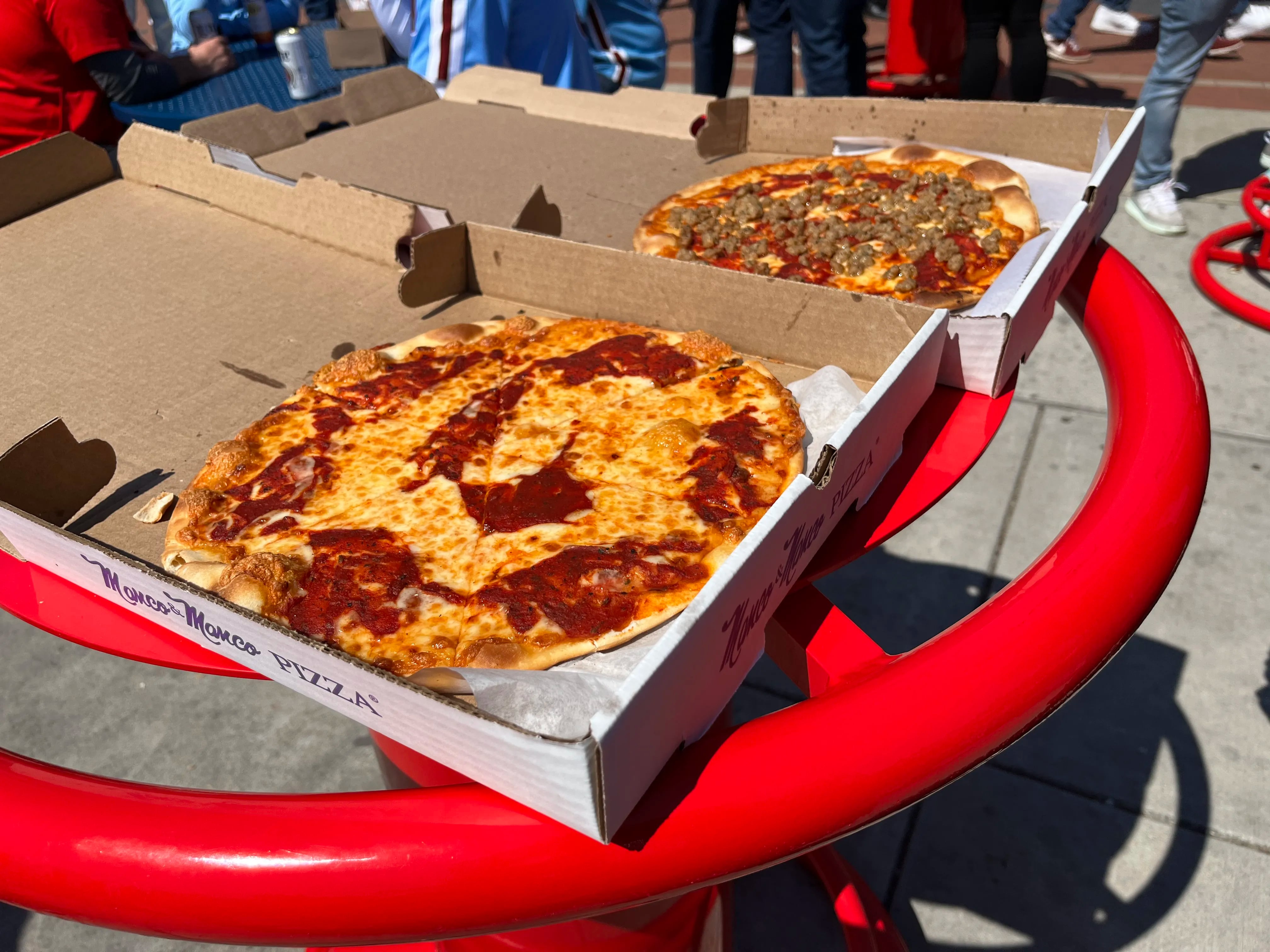 Plain cheese and sausage personal pizzas from Manco & Manco concession stand at Citizens Bank Park.