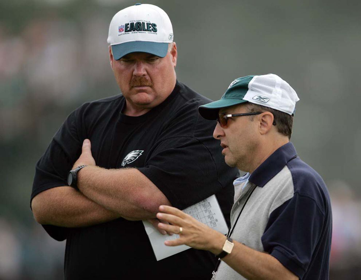 Coach Andy Reid (left) listening to Eagles team president Joe Banner in 2006. 