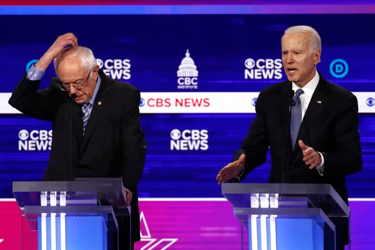 Sen. Bernie Sanders, I-Vt., and former Vice President Joe Biden, participate in a Democratic presidential primary debate in February.