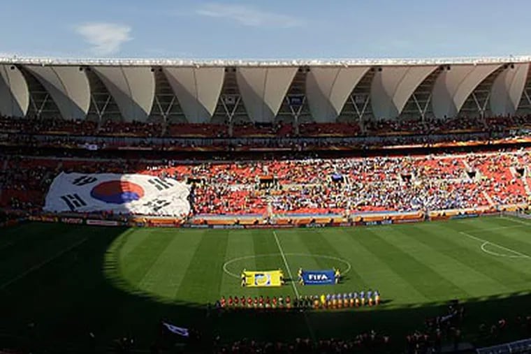 Thousands of seats were empty at the South Korea-Greece game in Port Elizabeth. (Thanassis Stavrakis/AP)